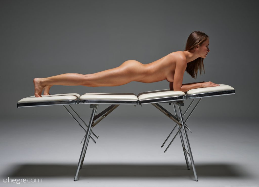 Natalia lounging naked on massage table 04