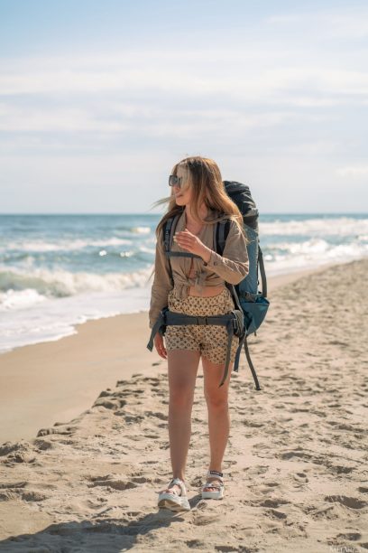 Shanti Black backpacker on the beach 01